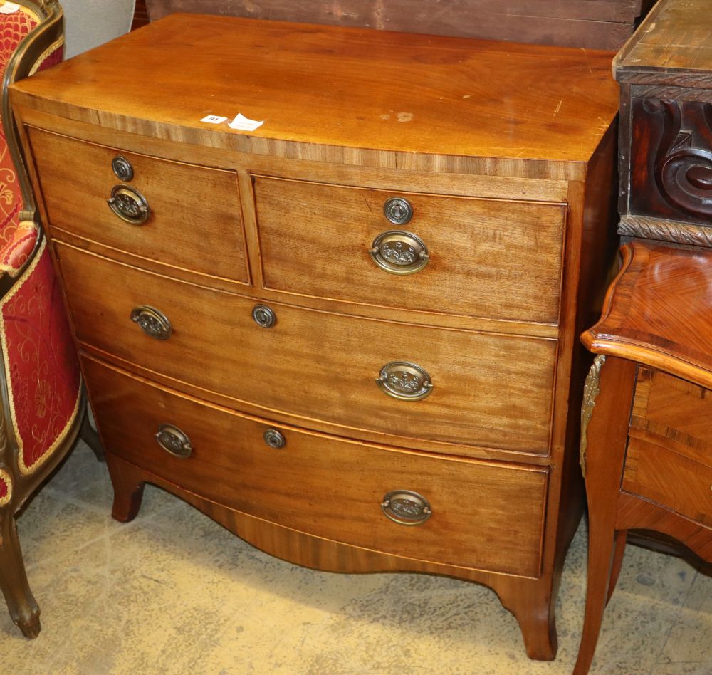 A Regency mahogany bow front chest of two short and two long drawers on splay bracket feet, W.90cm